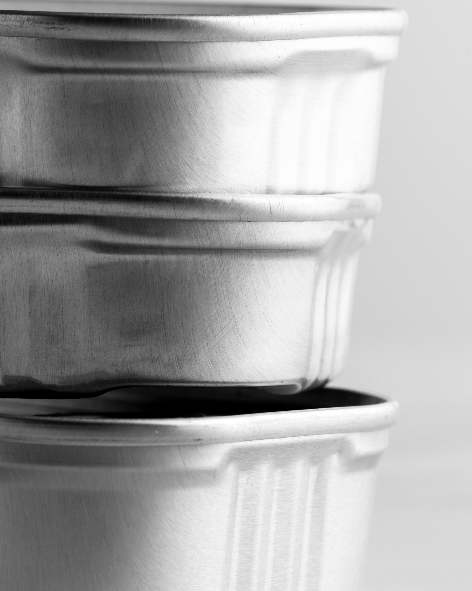 close-up-stack-silver-tin-cans